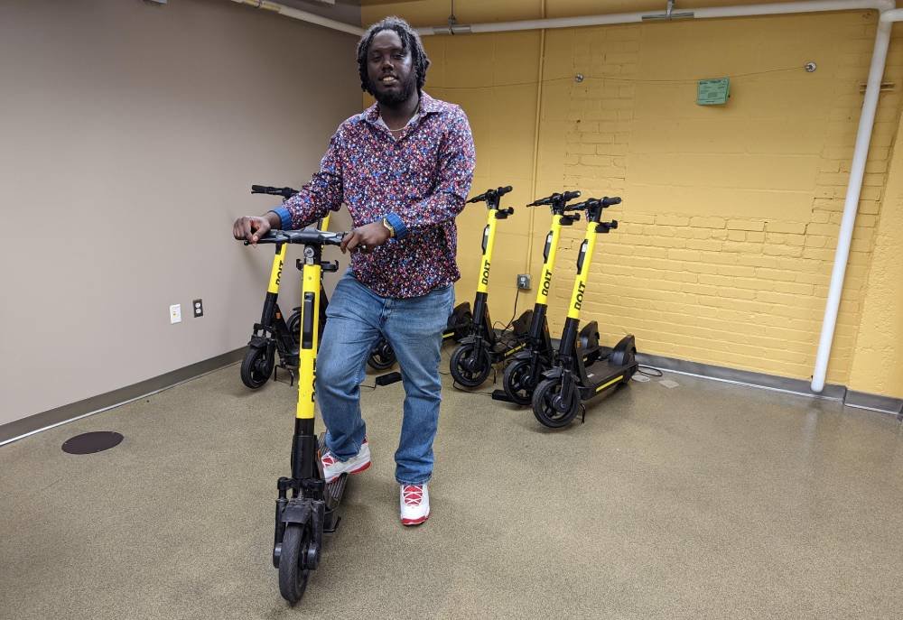 Williams shows off some of his company’s electronic transportation devices in his office at the Robert W. Plaster Free Enterprise Center.